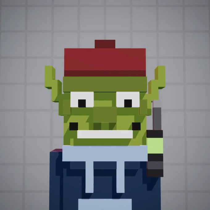 A 3D voxel art or Minecraft-style rendering of a green goblin or orc character with a wide mouth showing white teeth, wearing a red hat and blue overalls with white straps, against a grey grid background.