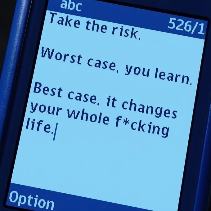 A close-up of a mobile phone screen displays a text message reading: 'Take the risk. Worst case, you learn. Best case, it changes your whole f*cking life.'