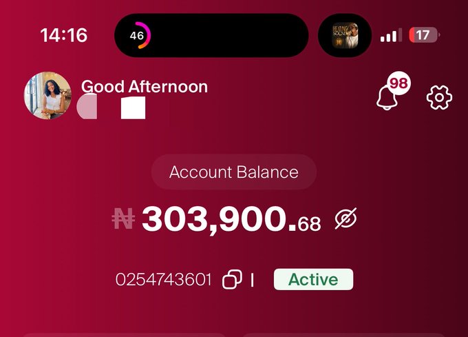A mobile banking app screenshot showing a "Good Afternoon" greeting with an Account Balance of ₦303,900.68 in an active account (0254743601), illustrating the automatic USDT-to-Naira conversion described in the post.