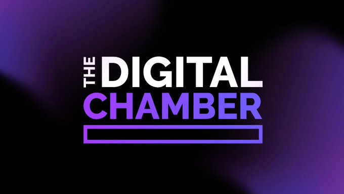 The image displays the logo for "The Digital Chamber," with "THE" in small white text, "DIGITAL" in bold white letters, and "CHAMBER" in purple, all set against a dark purple gradient background. This represents the organization leading the legal challenge against Illinois' new crypto transaction tax, the first of its kind in the United States targeting digital asset businesses.