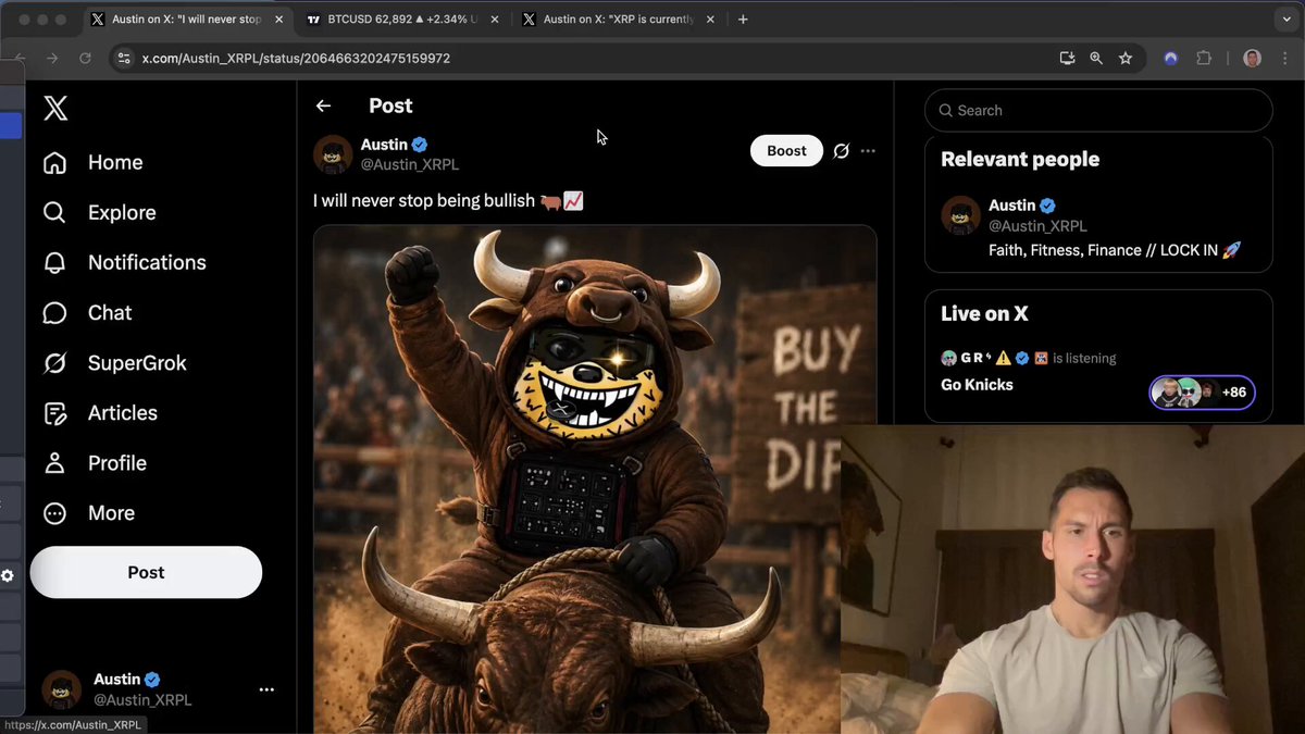 The image shows a man sitting down with his legs crossed while looking at a computer screen displaying a social media platform. The main focus of the image is a photo or video featuring a cartoon bull character, which appears to be the center of attention on the screen. The caption below the image reads "All of the reasons that the bottom is in for XRP, Bitcoin, and the crypto market." This suggests that there might be some discussion or information related to these digital assets being discussed on social media platforms.