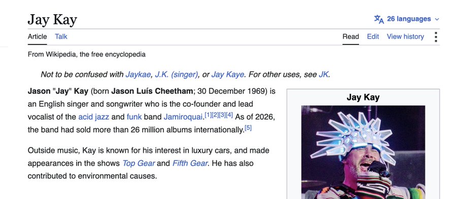 A Wikipedia article screenshot for 'Jay Kay', describing him as the co-founder and lead vocalist of Jamiroquai, alongside an image of him performing on stage in a crystal headdress.