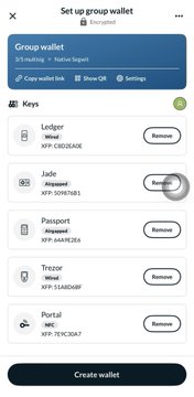 A digital interface screen for setting up a 'Group wallet' with various cryptocurrency keys listed, including Ledger, Jade, Passport, Trezor, and Portal, each with a 'Remove' button.