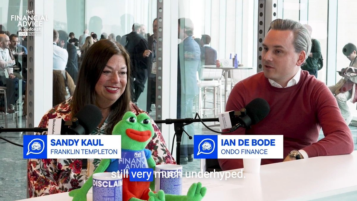 Sandy Kaul from Franklin Templeton and Ian De Bode from Ondo Finance appear on the "Not Financial Advice" podcast at Blockworks DAS, with on-screen text reading "still very much underhyped," directly visualizing the post's discussion of whether AI agents are overhyped or underhyped heading into the next year.
