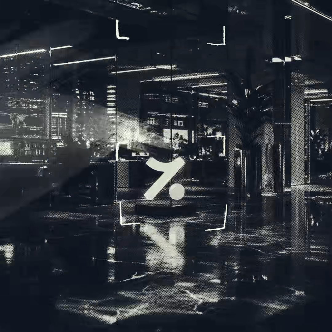 A black-and-white halftone-style image of a dark, rainy urban street with a person holding an umbrella, overlaid with a stylized white 'Y.' logo in the center.