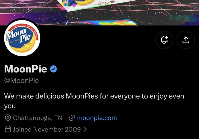 The image shows the official Twitter/X profile page for **MoonPie (@MoonPie)**, featuring their logo, the bio "We make delicious MoonPies for everyone to enjoy even you," and indicating they are based in Chattanooga, TN, having joined in November 2009. The profile header appears to show a colorful MoonPie packaging design, tying in nicely with a "dream collab" post that likely announces a partnership or creative collaboration with the popular snack brand.