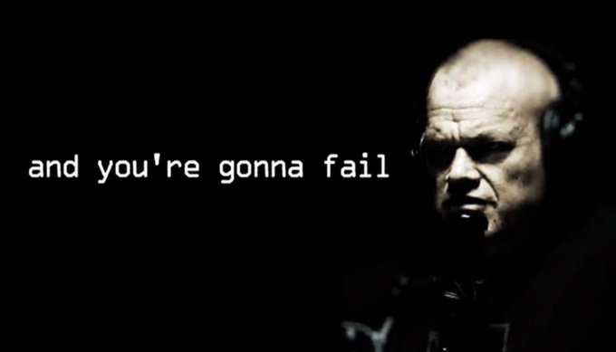 A dark, cinematic image featuring a serious-looking man wearing headphones, with the white text "and you're gonna fail" overlaid on the left side.