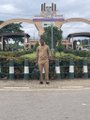 A person stands at the entrance arch of the University of Benin in Nigeria, while the post describes the image as capturing the founder of the ARC community introducing friends to crypto and Web 3 concepts during a campus visit.