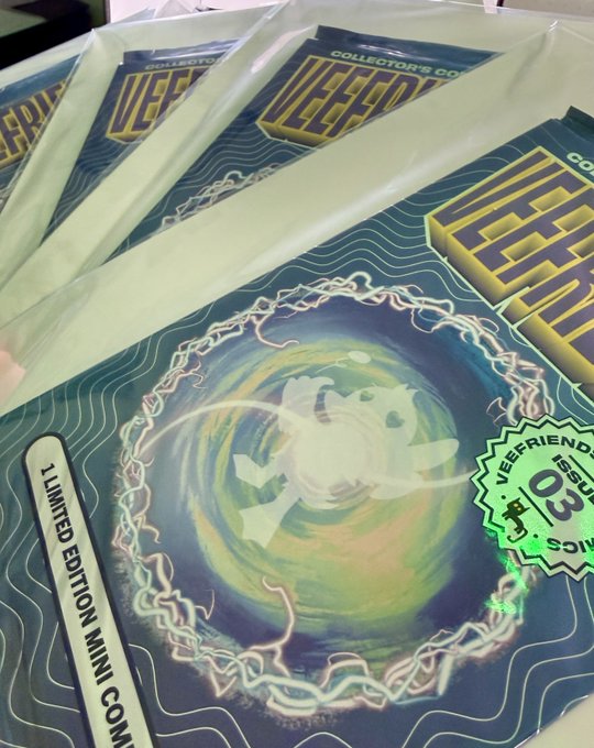 Several copies of a 'VeeFriends' Collector's Comic book, Issue 03, laid out in a row on a surface.