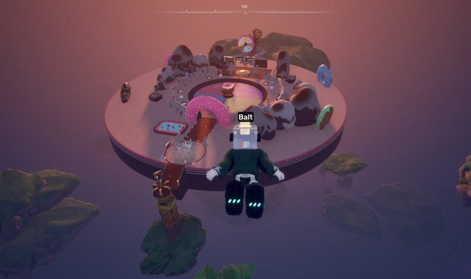 A screenshot from a video game showing an avatar named "Bait" standing before a circular island filled with various oversized sweets and candy decorations in a hazy, pinkish environment.