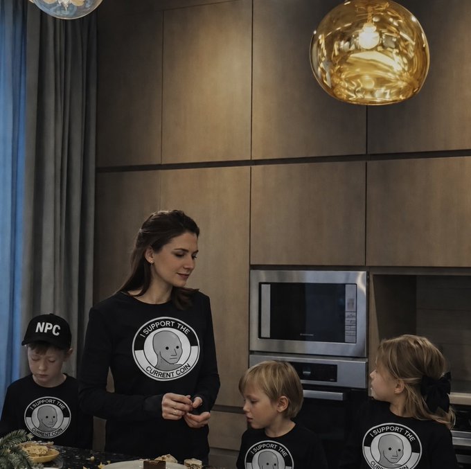 A woman and three children wear matching black shirts reading 'I SUPPORT THE CURRENT CONS' with a bald face logo; the woman also wears an 'NPC' cap, standing in a modern kitchen.