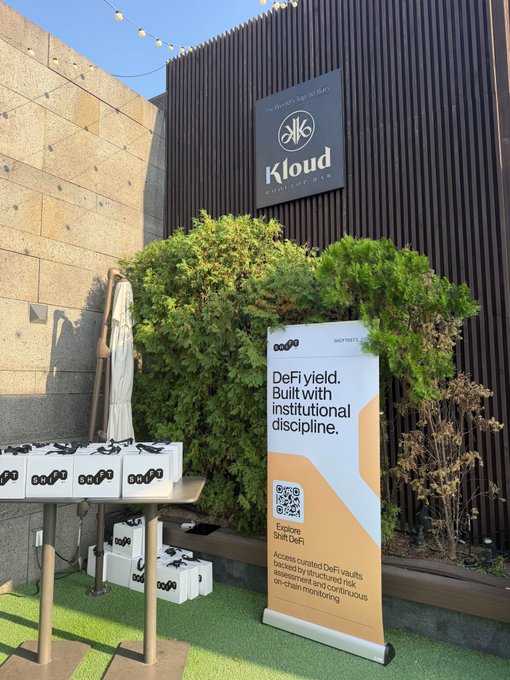 An outdoor scene features a Kloud beer bar sign and a promotional banner for 'DeFi.yield' with the text 'Built with institutional discipline' and a QR code to explore Shift DeFi.