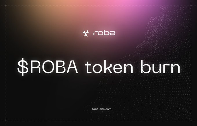 A sleek, dark gradient graphic with a purple-pink glow displays the "roba" star logo alongside the headline "$ROBA token burn" and the URL "robalabs.com," visually announcing the platform's first scheduled token buyback and burn tied to its Compute marketplace and No-code studio revenue milestones.