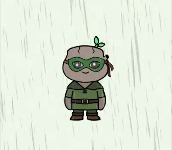 A cartoon character, resembling a young Robin Hood with green mask and a sprout on its head, stands in the rain. This image likely represents the @robinwoodNFT project's upcoming launch.