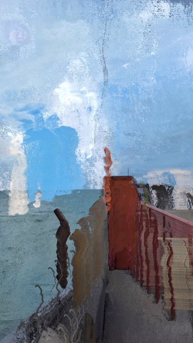 An abstract, painterly image depicting what appears to be a coastal scene with a red structure or building against a textured blue sky and water.