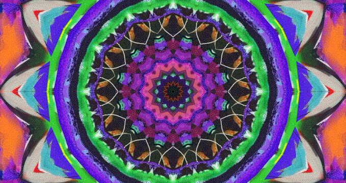A colorful, symmetrical kaleidoscope mandala pattern in purple, green, blue, and orange hues.