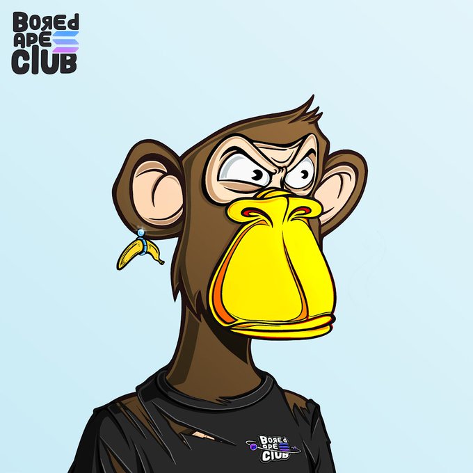 The image features a cartoon monkey wearing a black shirt with white text that says "Bored Are You?". The monkey has a yellow nose, an orange mouth, and a brown body. It appears to be looking at something or someone off-camera, possibly indicating curiosity or interest in its surroundings.