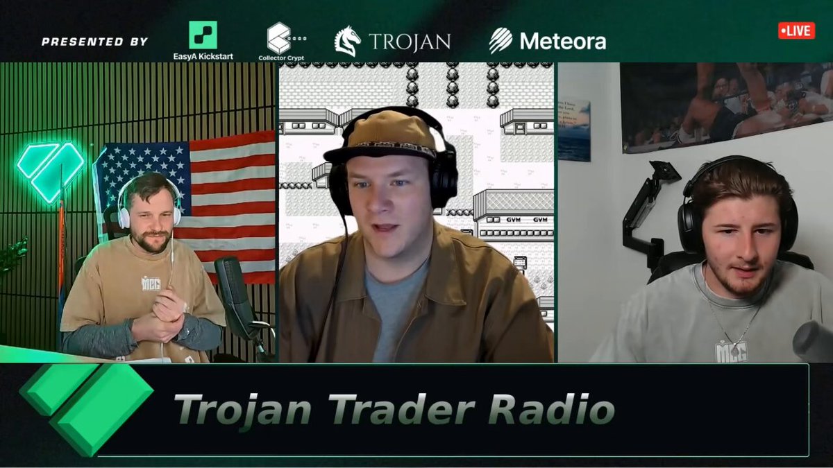 The image features a group of three men wearing headphones, all engaged in a conversation or discussion. They appear to be talking about cryptocurrency or blockchain technology, which might be relevant to the podcast they are listening to. The audio data from this recording can be accessed through the Trojans Trader Radio app on an Apple device such as a Macbook Pro or a PC with a USB microphone installed.