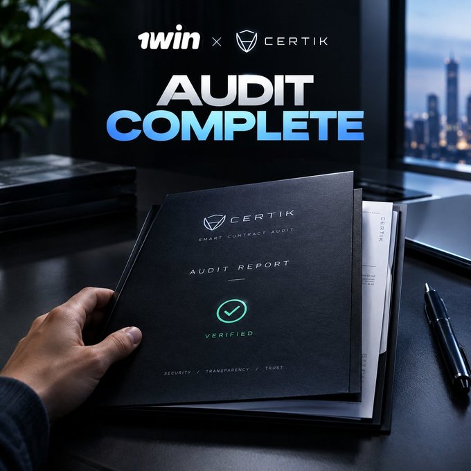 The image shows a person holding a black "CERTIK Smart Contract Audit Report" folder marked with a green "VERIFIED" checkmark, set against a city skyline backdrop. At the top, text announces "1win × CertiK" and "AUDIT COMPLETE" in bold lettering, visually confirming the completion of the security audit for the 1win token.