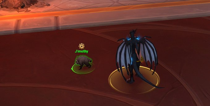 A World of Warcraft-style game screenshot showing a character named 'Jimothy' (a small creature) facing a large blue dragon-like creature.