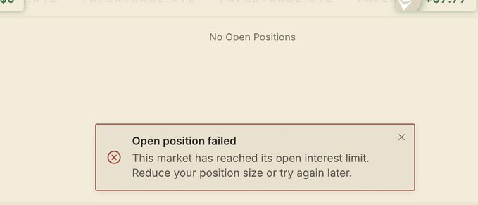 A trading interface error message stating 'Open position failed: This market has reached its open interest limit. Reduce your position size or try again later.' under 'No Open Positions'.