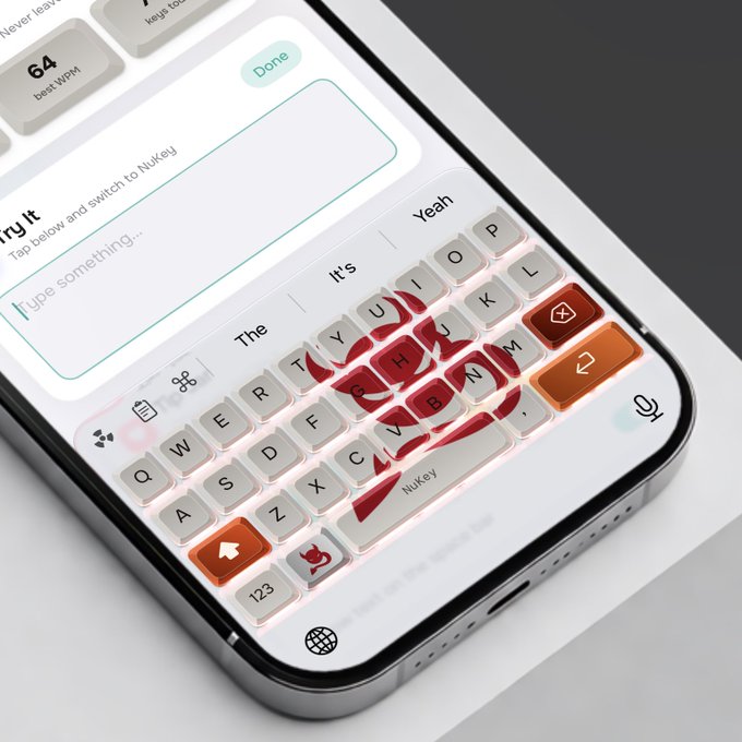 A smartphone displays a custom keyboard app called NuKey with a skull and rose design on the keys, showing predictive text suggestions like 'The', 'Yeah', and 'It's' above the keyboard.
