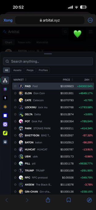 A mobile screenshot of the Arbitrum (arbital.xyz) market showing various meme tokens with prices and 24-hour changes, including PAID (+24302.54%), ELON (+4649.17%), LOCKINU (+1793.58%), DELTA (+3.00%), and GROK POT (+785.54%).