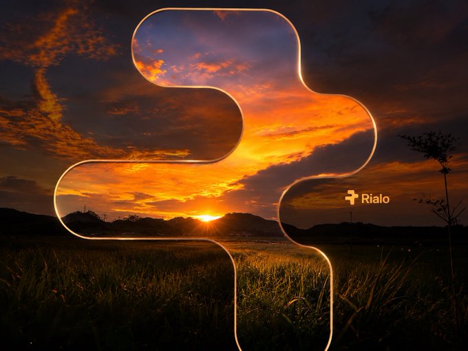 A stylized sunset photo featuring a decorative glow-outline frame in the shape of the Movement (MOVE) blockchain logo, with a 'Rialo' watermark visible against the dramatic orange sky.