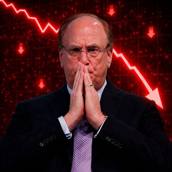 A man in a dark suit with a lavender tie holding his hands together in a prayer-like gesture, set against a dramatic red background with downward-trending stock chart arrows.