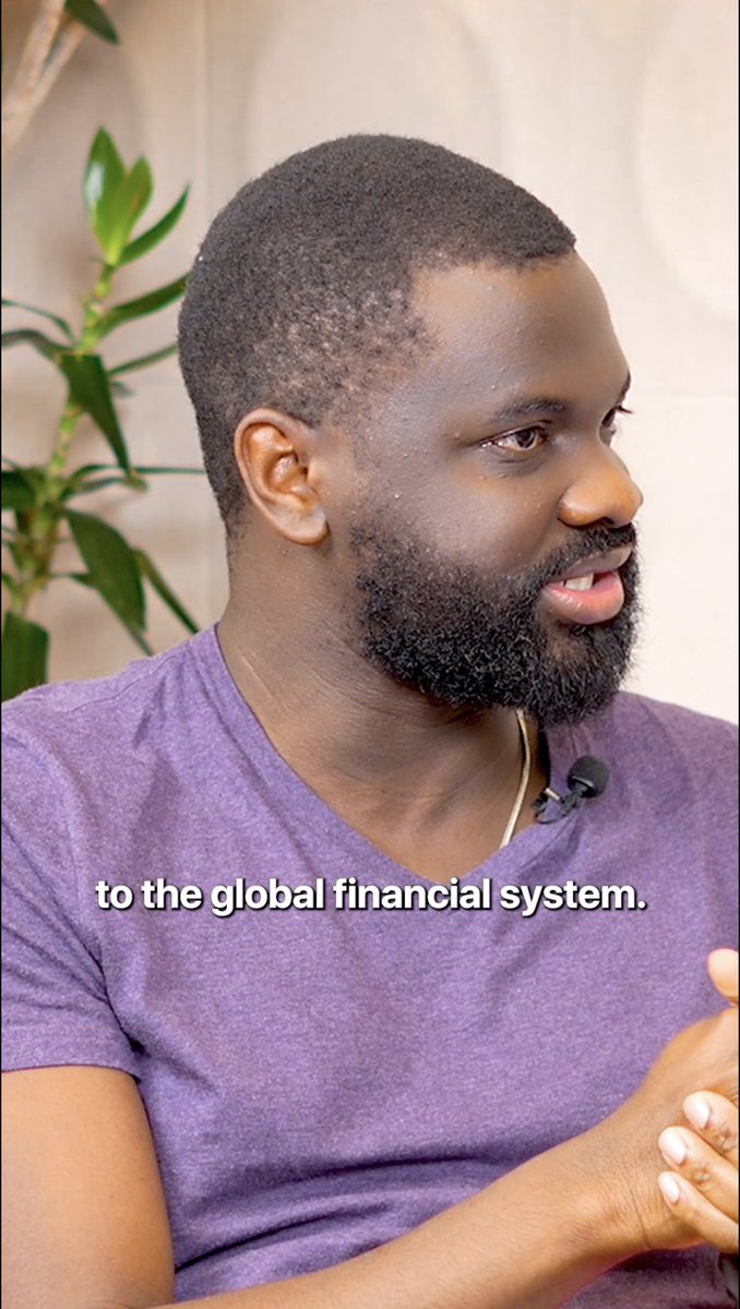 A man with a short beard, wearing a purple t-shirt and a lapel microphone, is speaking during an interview, with the caption "to the global financial system." displayed on screen. The image appears to be from a discussion about how cross-border payment rails support both small businesses and everyday individuals in Nigeria's economy, as mentioned in the accompanying post featuring @Daya_HQ's @alephile and Aptos Foundation's @aptAlix.