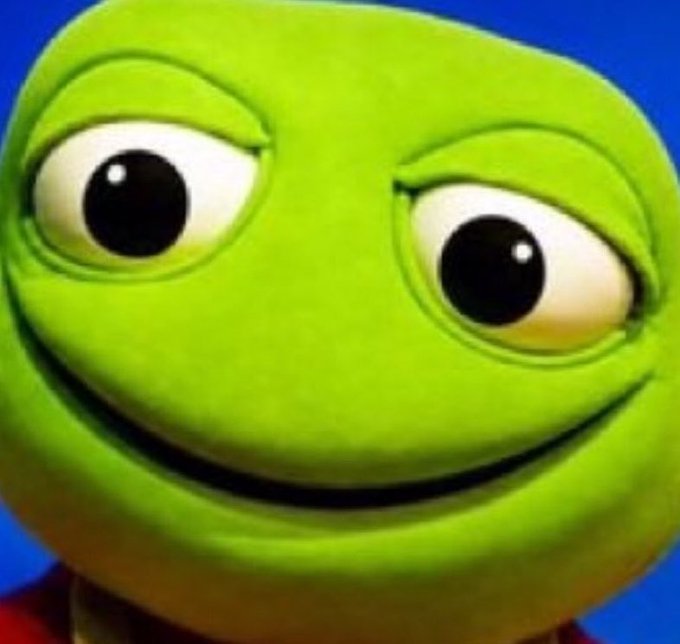 A smiling green Pepe the Frog toad emoji against a blue background, paired with a post referencing "Toad mode" and the meme's playful, mischievous expression mirrors the poster's admission of trash-talking crypto runners purely for engagement.