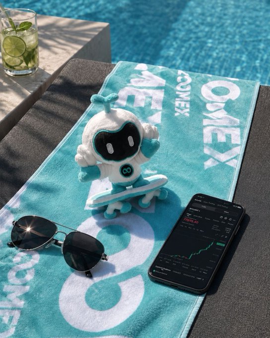 A turquoise Yonex beach towel lies poolside beneath a small white robot plushie holding a skateboard, paired with black aviator sunglasses and a smartphone displaying a stock chart green line.