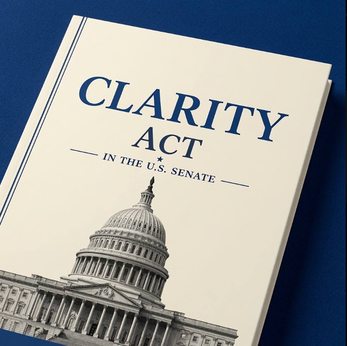 A stylized image displays a document cover titled "CLARITY Act in the U.S. Senate" in dark blue text against a cream background, with a black-and-white illustration of the U.S. Capitol dome at the bottom, all set against a deep blue background—visually reinforcing the legislative milestone referenced in the post.