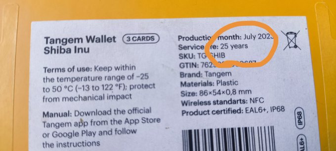 The back of a Tangem Wallet packaging for Shiba Inu showing product details, with 'July 2024' circled in orange marker, indicating a production date.