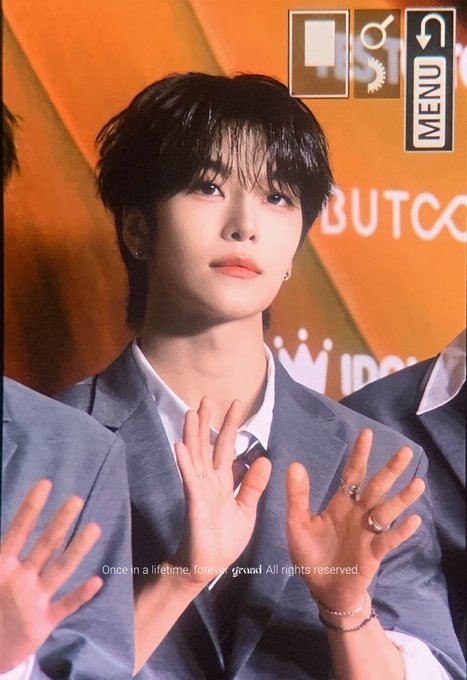 The image features a young man wearing a suit, standing against an orange background with his hands raised. The text "Once in a while, great things happen" can be seen near him. This suggests that he might have achieved something significant or experienced an extraordinary event recently.
