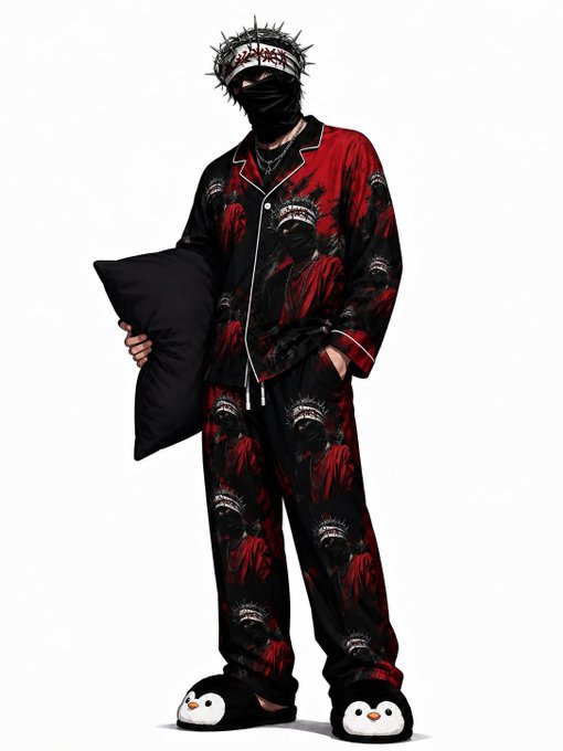 A streetwear model wearing a crown of thorns, a black face mask, red and black patterned pajama set with tooth graphics, penguin slippers, and holding a black pillow.