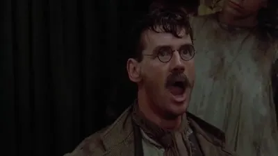A man with glasses and a mustache stands with his mouth wide open in apparent shock or awe, possibly reacting to the absurdity of the crypto tribalism described in the accompanying monologue, which declares allegiance to Litecoin among the various factions of cryptocurrency enthusiasts.