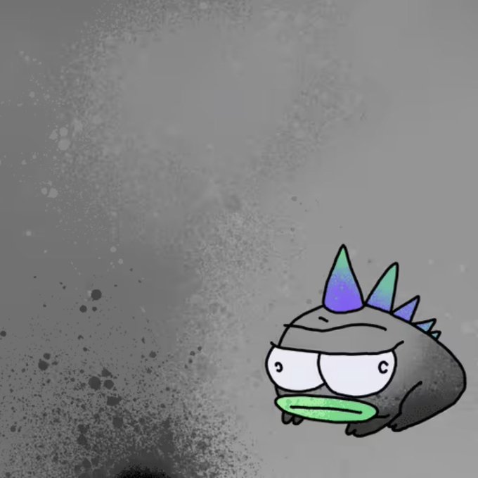 A cartoon character resembling a dark, round creature with purple and green spikes on its head, large wide eyes, and a green mouth, set against a gray, textured background.