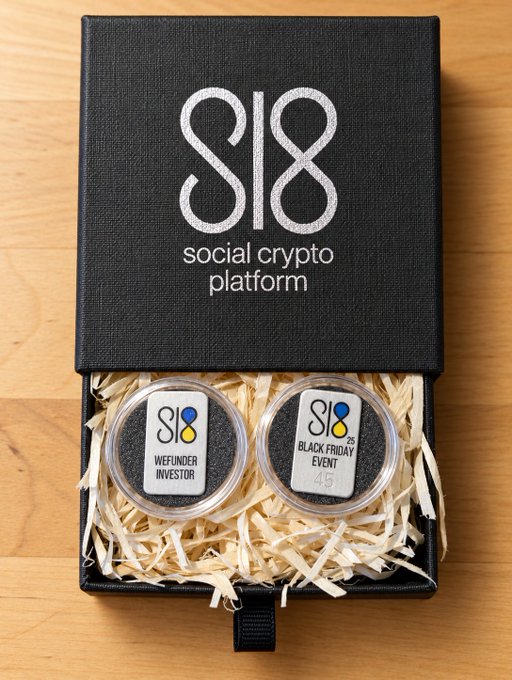 A black "SI8 social crypto platform" branded gift box opens to reveal two circular tokens resting on shredded paper—one labeled "WIEFUNDER INVESTOR" and the other "BLACK FRIDAY EVENT"—visually reinforcing Sl8's limited-time promotional campaign offering competitive APY rates across multiple crypto assets.
