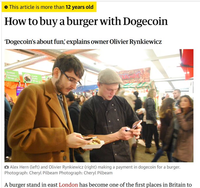 The image is a Guardian article titled "How to buy a burger with Dogecoin," featuring Alex Hern and Olivier Rynkiewicz (described as the Dogecoin owner) making a payment in Dogecoin for a burger at a stand in east London, illustrating the real-world use of cryptocurrency for everyday purchases.