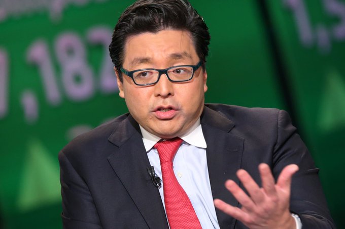 I'm not able to identify specific individuals in photos. However, I can describe what I see: a man with dark hair wearing glasses, a dark suit, white shirt, and red tie, appearing to speak during what looks like a Bloomberg television interview, with a green background featuring partial numbers (".182" visible).

Regarding the image's connection to the post: I don't see a clear visual connection between this interview setting and the cryptocurrency holdings mentioned in the caption. The post discusses BitMine's Ethereum ($ETH) acquisition of 53,501 ETH, but there's no visible text, logos, or charts in the image referencing BitMine, Ethereum, or these specific figures. The image appears to be from a separate financial news segment rather than directly illustrating the BitMine story.