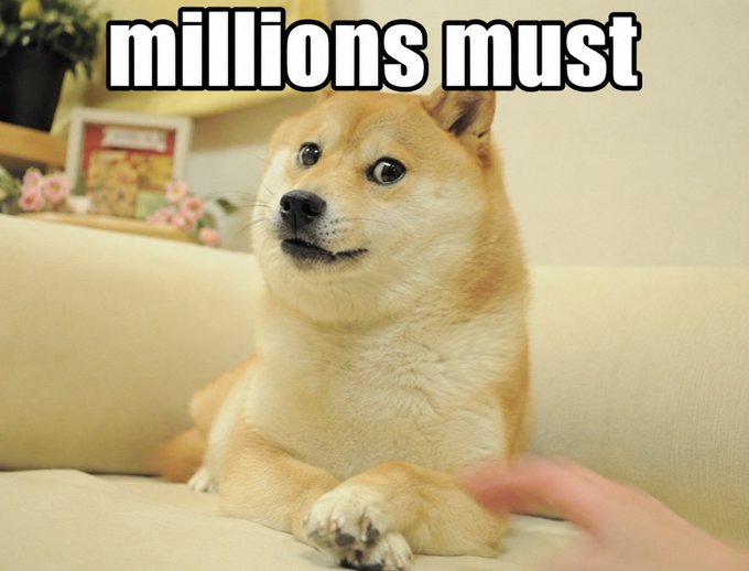 A Shiba Inu dog sits on a beige couch looking up with a curious expression at a person's hand reaching toward it. White text overlaid on the image reads 'millions must'.