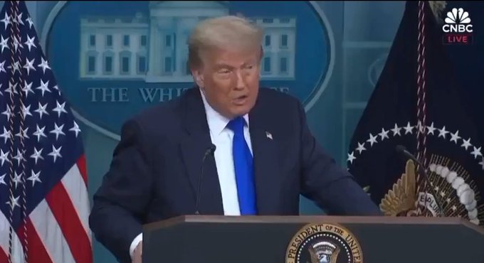 Donald Trump speaks at a press podium in front of the White House. The CNBC logo is visible in the upper right corner.