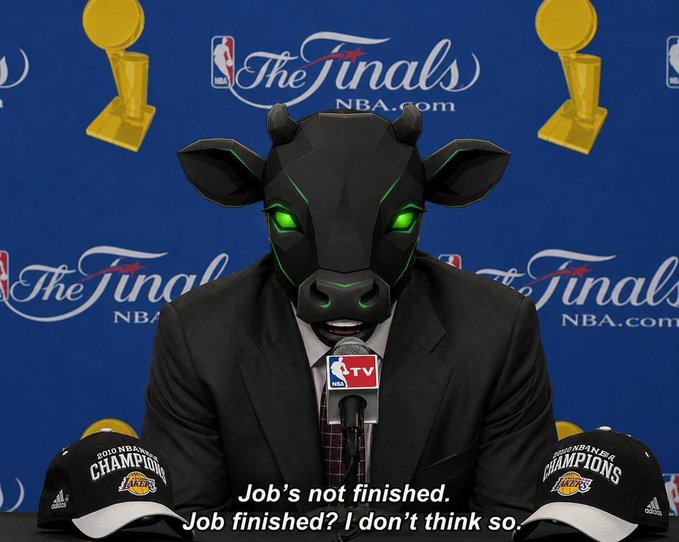 A figure in a black bull mask and suit speaks at a press conference with "The Finals NBA.com" backdrop, flanked by two "2010 NBA Champions Lakers" hats and an NBA TV microphone, with subtitles reading "Job's not finished. Job finished? I don't think so."

The image's defiant "job not finished" quote mirrors the post's bullish conviction that the $BABYANSEM dip is a buying opportunity with much higher upside ahead.