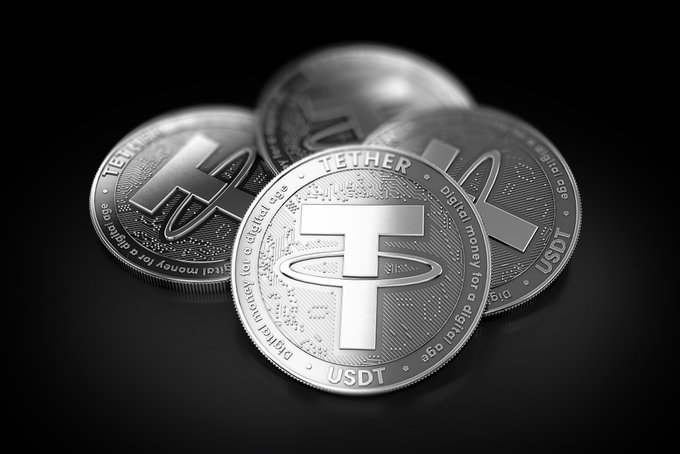 A 3D rendering of three silver 'TETHER' (USDT) cryptocurrency coins stacked on a black background, featuring the words 'Digital money for a digital age'.