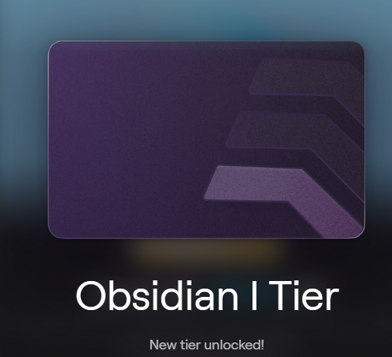 The image shows a dark purple and black card with geometric claw-like designs, labeled "Obsidian I Tier" with "New tier unlocked!" text below it. This represents the user's achievement of reaching the Obsidian level on AbstractChain after 1.5 years of dedicated work.