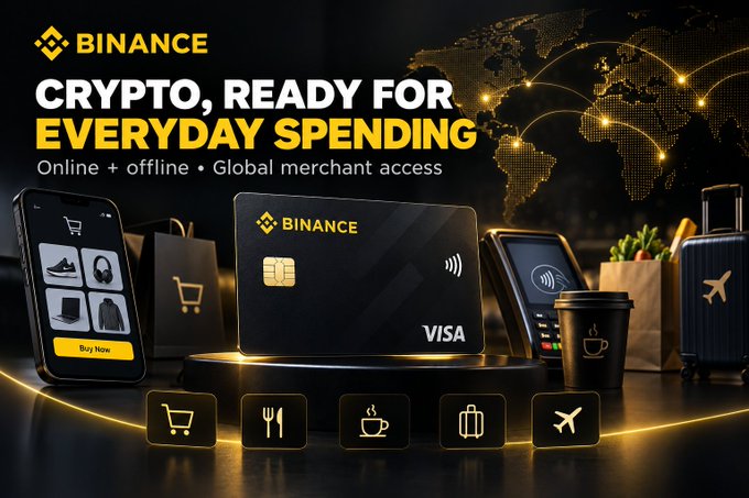 A promotional banner featuring the Binance Card (a Visa-branded black card) alongside a smartphone, payment terminal, coffee cup, shopping bags, and luggage, with the headline "BINANCE — CRYPTO, READY FOR EVERYDAY SPENDING" and icons representing shopping, dining, coffee, travel, and flights — visually reinforcing how the card enables crypto to be used for everyday online and offline purchases globally.