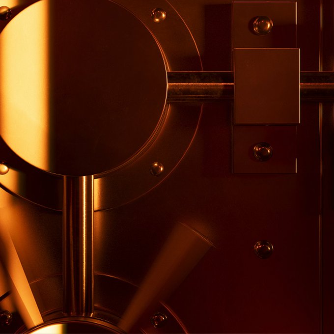 A close-up image of polished, warm-toned metallic machinery featuring cylindrical components, bolts, and industrial architectural details illuminated by dramatic lighting.