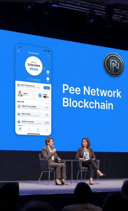 Two women sit on stage during a presentation for "Pee Network Blockchain," with a large screen displaying the Pee Network app interface showing a balance of 2256.0084 PEE. The scene illustrates the public promotion of the Pee Network Mobile Mining opportunity being shared with potential users, aligning with the post's message about spreading awareness of the early-stage program to others.