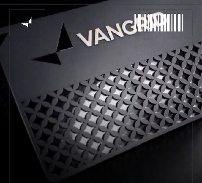 A dark metallic surface with a perforated geometric pattern, featuring 3D silver text reading 'VANGHARAN' and 'JBUSTAM' alongside a black star-like logo.
